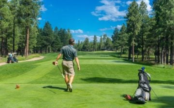 A person swinging a golf club