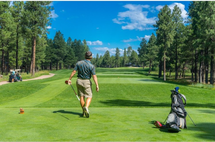 A person swinging a golf club