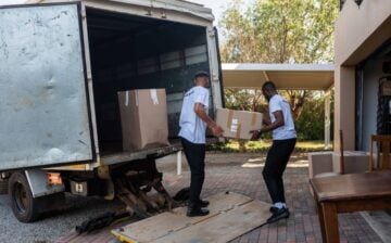 movers loading boxes onto a moving truck