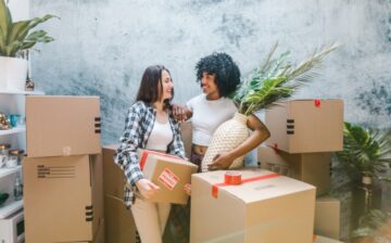 Movers in NYC holding boxes