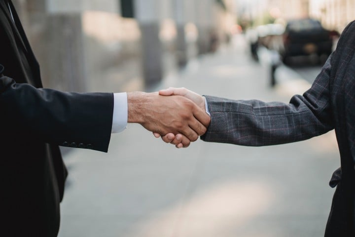 Two people shaking hands