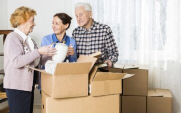 Seniors moving boxes