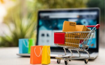 shopping cart with boxes and bags and computer