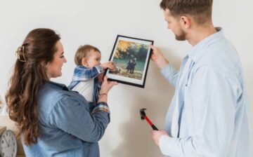 family with baby watching photo