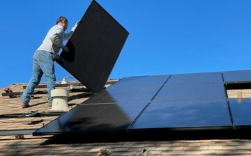 man placing solar panels