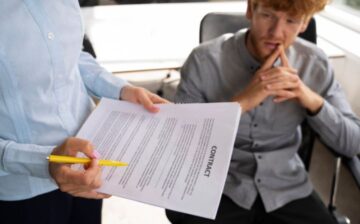lawyer reviewing a contract with employee