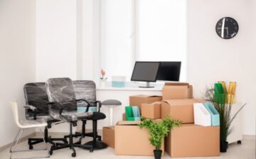 office with packed chairs and moving boxes