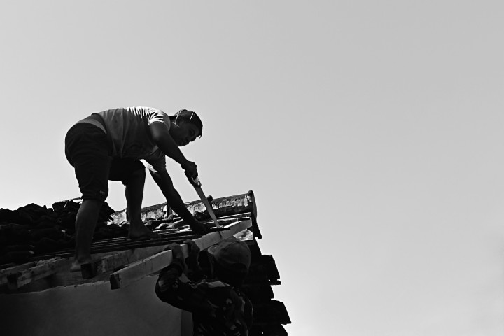 people working on roof