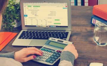 woman with computer and calculator