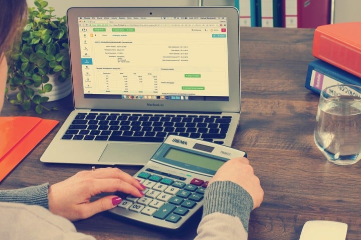 woman with computer and calculator