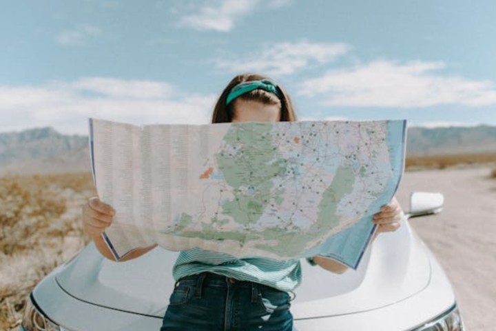 woman with map on route