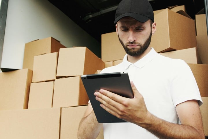 Man checking moving checklist