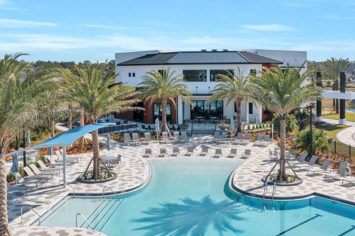 building with large pool with solarium