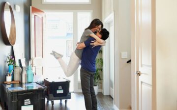 couple hugging just moved to a new house