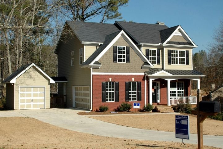 house with FOR SALE sign