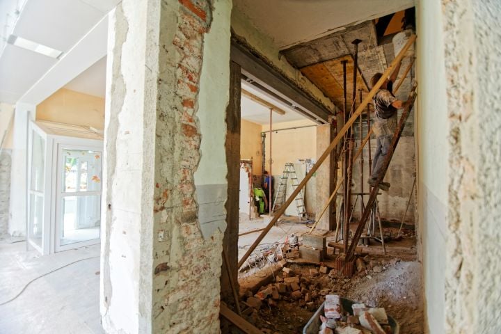 man working on house remodeling