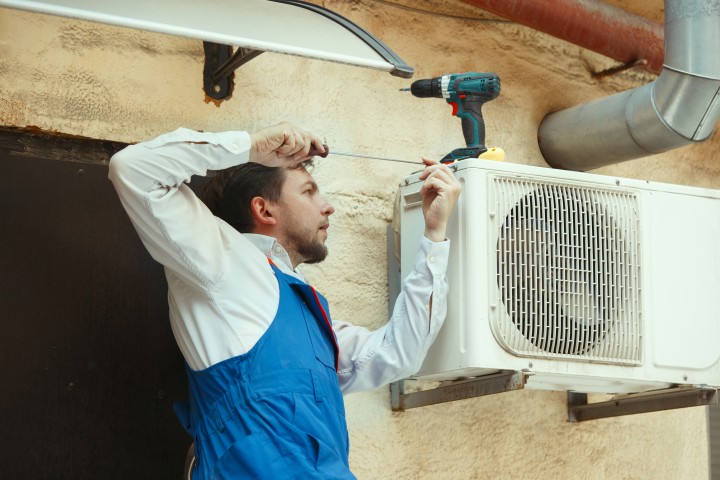 man working on Regas air conditioning