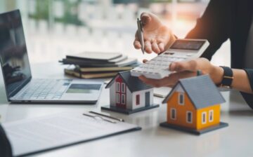 woman showing calculator to home buyer