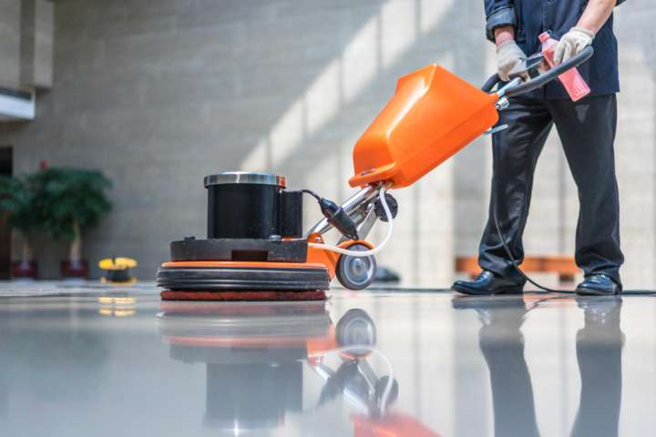 Man polishing the polisher in the lobby