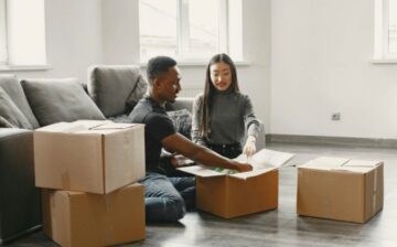 couple packing moving box