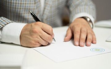man signing contract for the comfort of his home