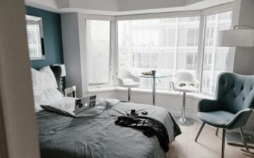 room decorated with bed and chairs matching