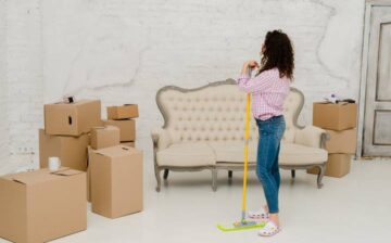woman cleaning her old house before moving