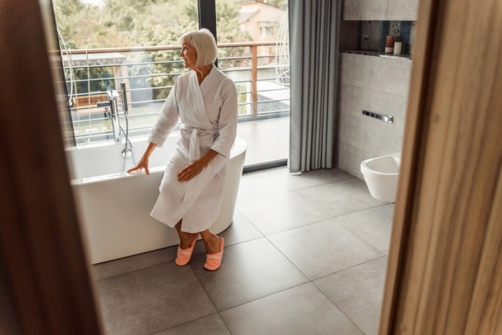 woman sitting in bath tub