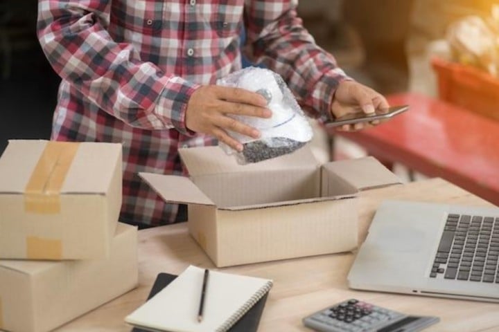 man packing product