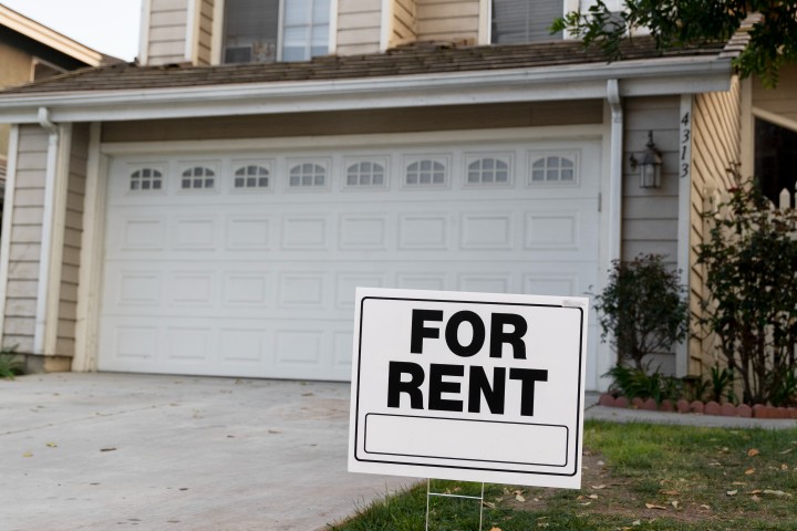 house with a for rent sign