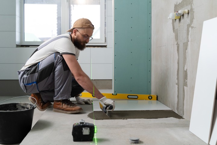 man working on bathroom renovation