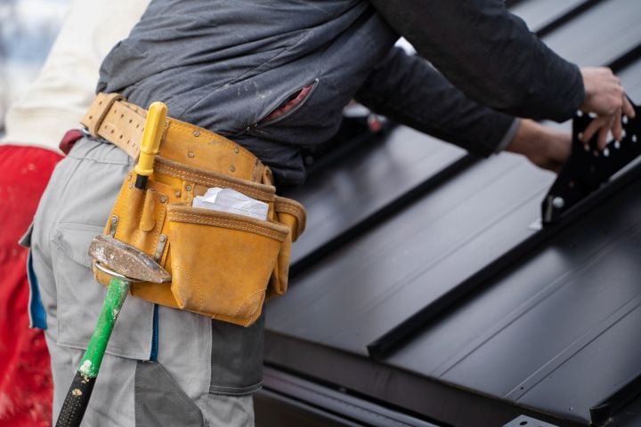 man working on roof maintenance