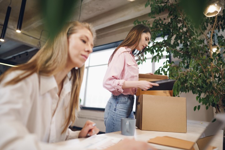 women working in moving office