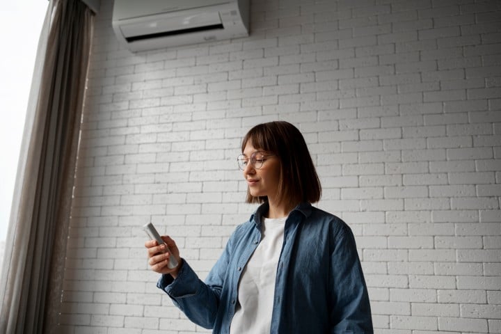 young woman using home technology
