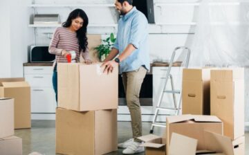couple packing for their move