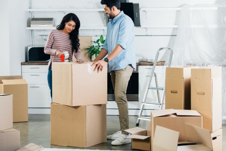 couple packing for their move