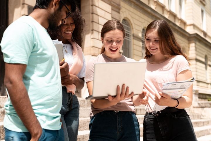 group of students with a computer
