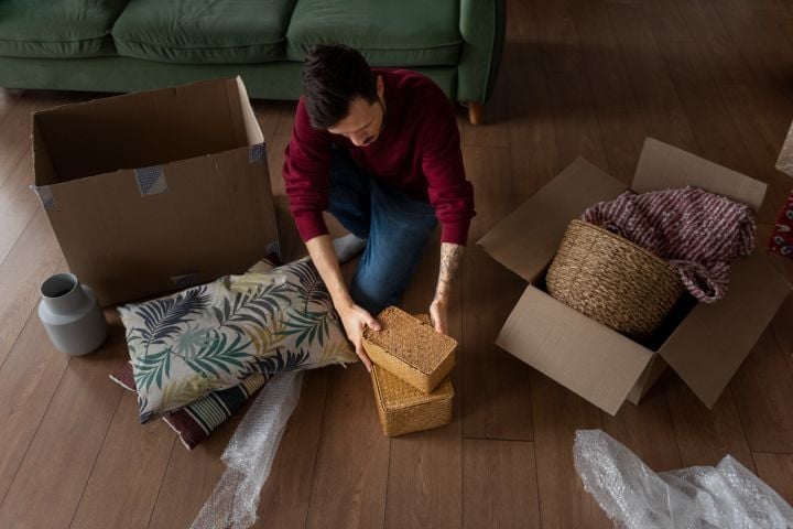 young adult moving into new home