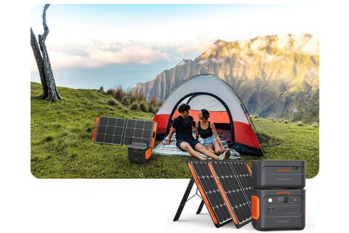  couple in carp with electricity generator in the mountains
