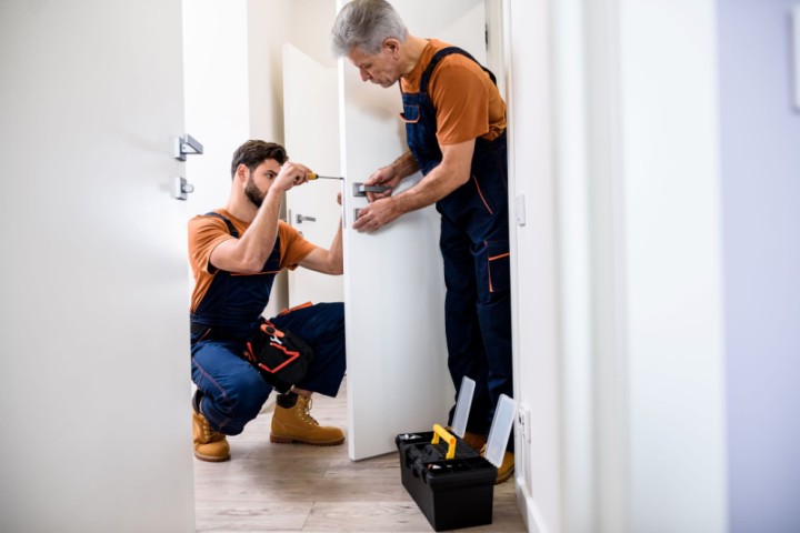 men installing lock
