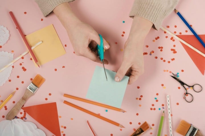 woman making crafts with papers
