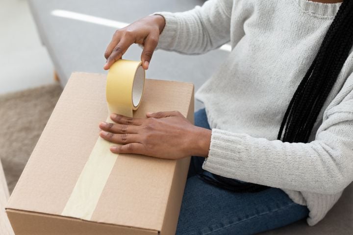 woman packing fragile items