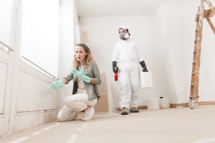 woman pointing at wet spot