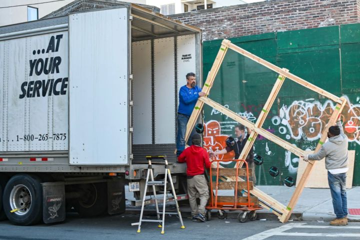 Man loading moving items into truck