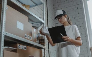 Woman checking inventory of her business