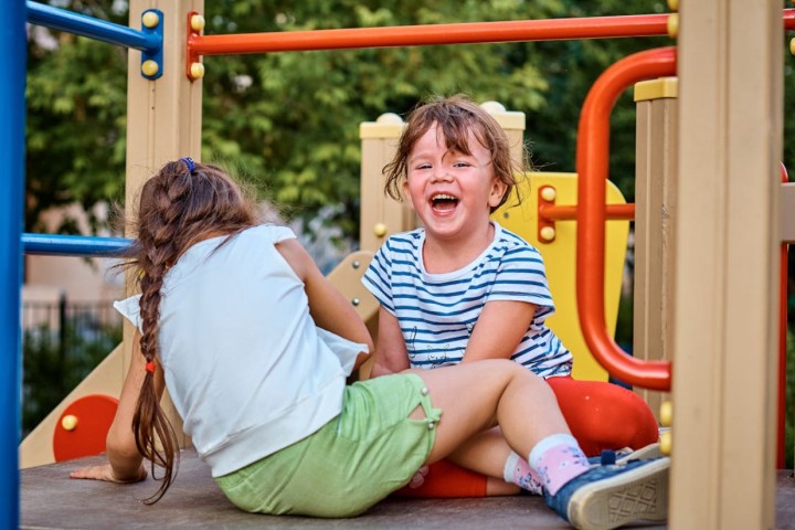 boys playing in the park of the house