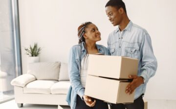 couple moving new home together couple with cardboard boxes