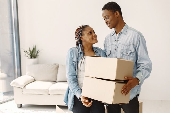 couple moving new home together couple with cardboard boxes