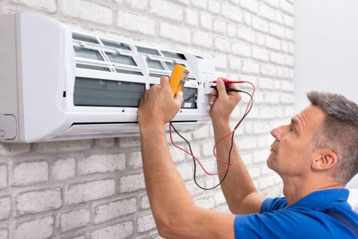 man fixing air conditioning