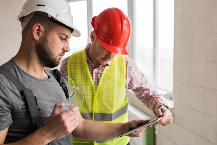 men inspecting house